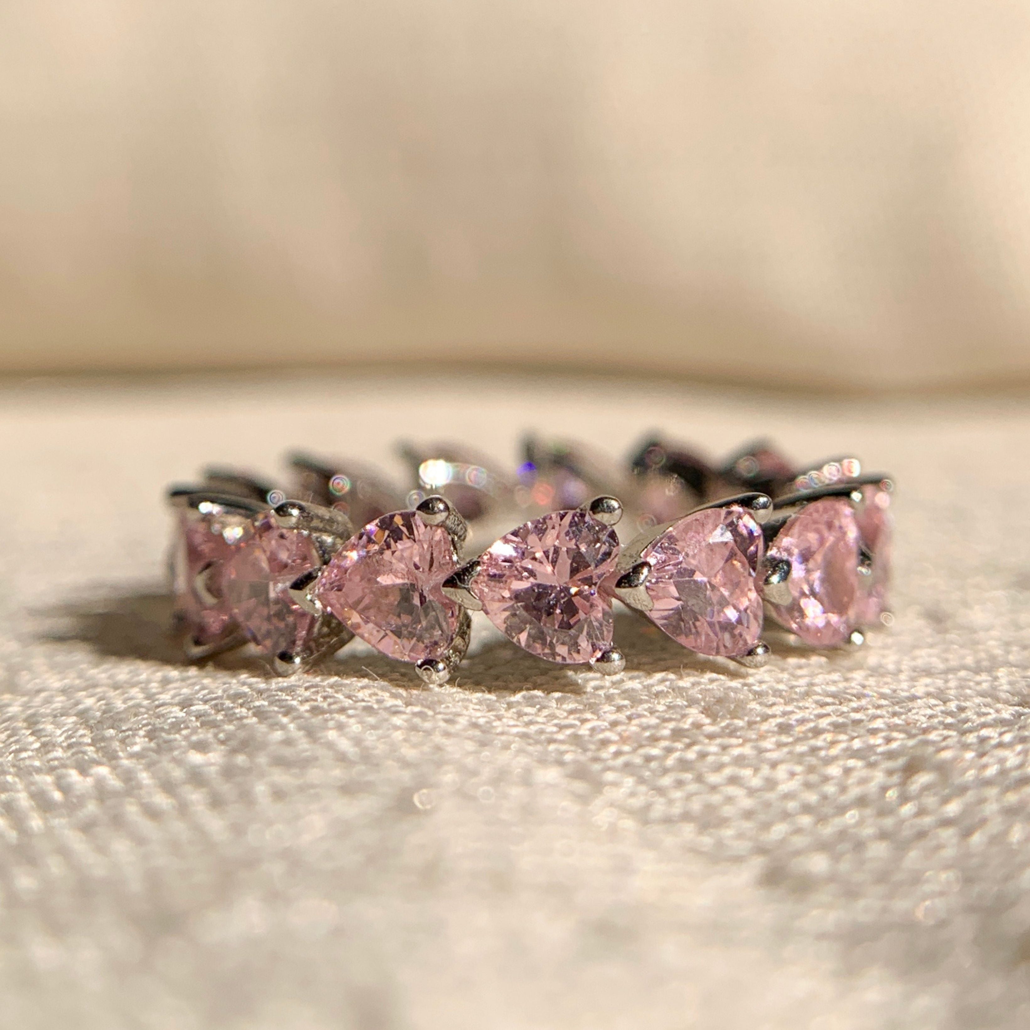 Pink diamond eternity band in heart shape design, set in fine gold